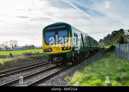 Commuter rail service traveling via Maynooth to Dublin`s Pears Station. Travelling by train in Ireland Stock Photo